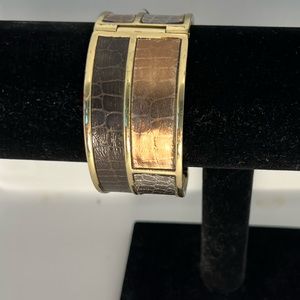 Gold plated, bangle bracelet. With snap closure.